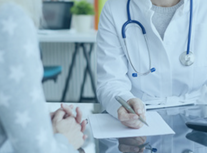 Doctor with Patient and Laptop